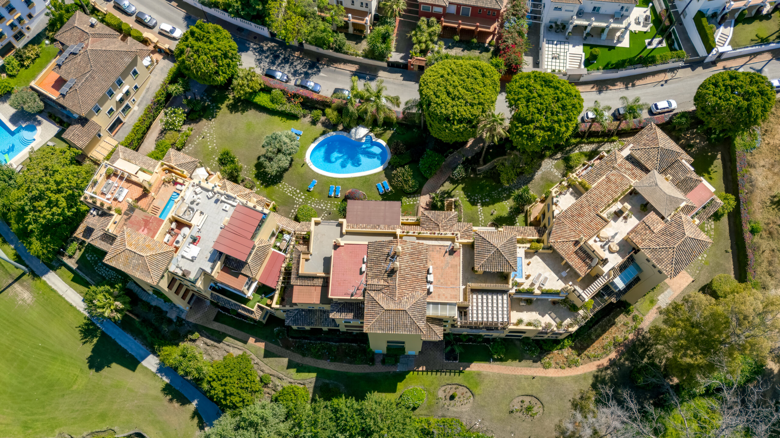 Aerial view of villas with private pools in a Costa del Sol urbanisation