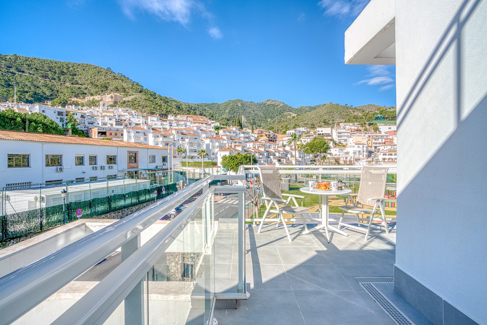 Terrace view over Benahavis hills and village – Costa del Sol, photo by Your Property Concept