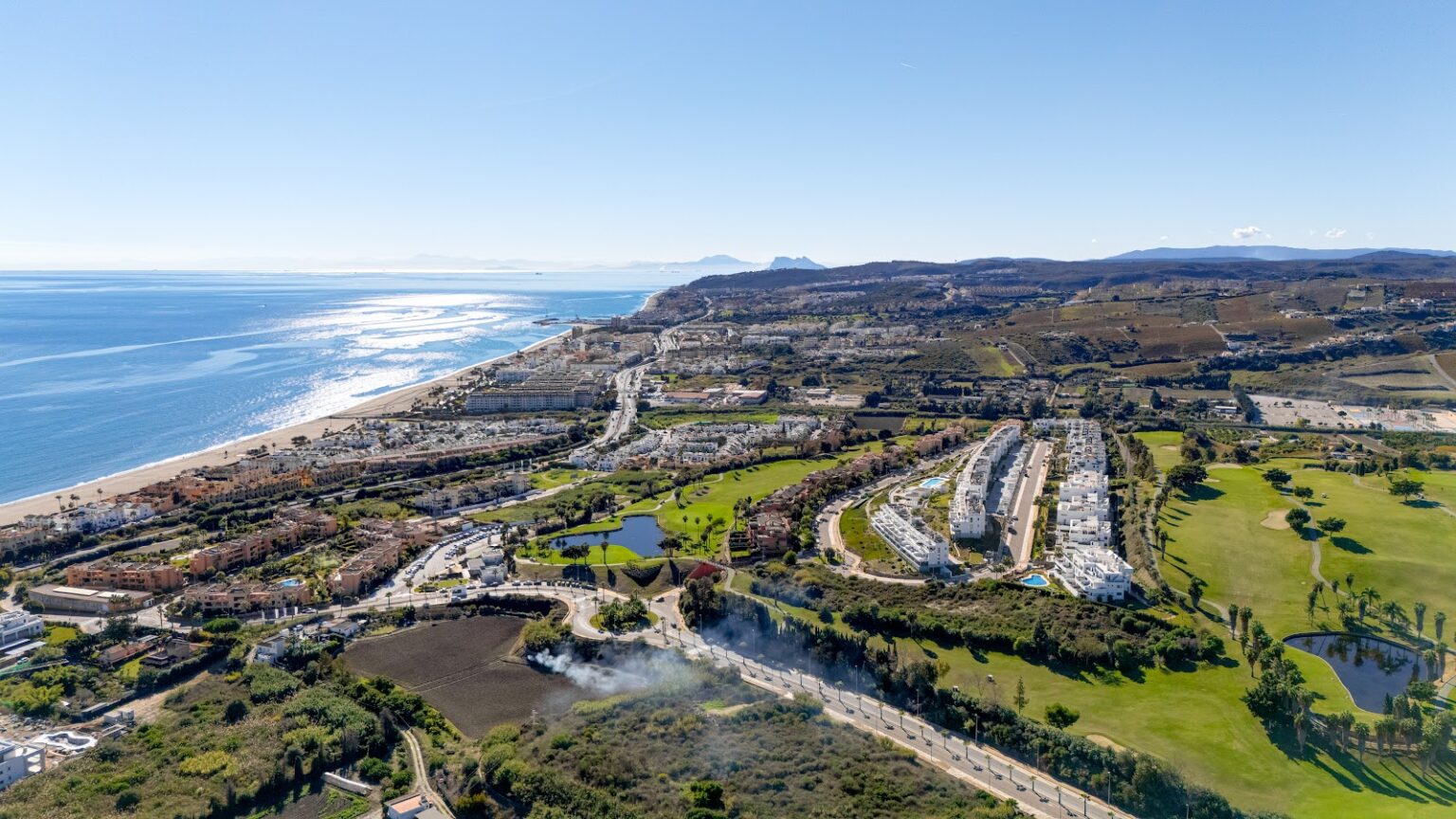 Aerial coastline with development and sea – Costa del Sol, photo by Your Property Concept